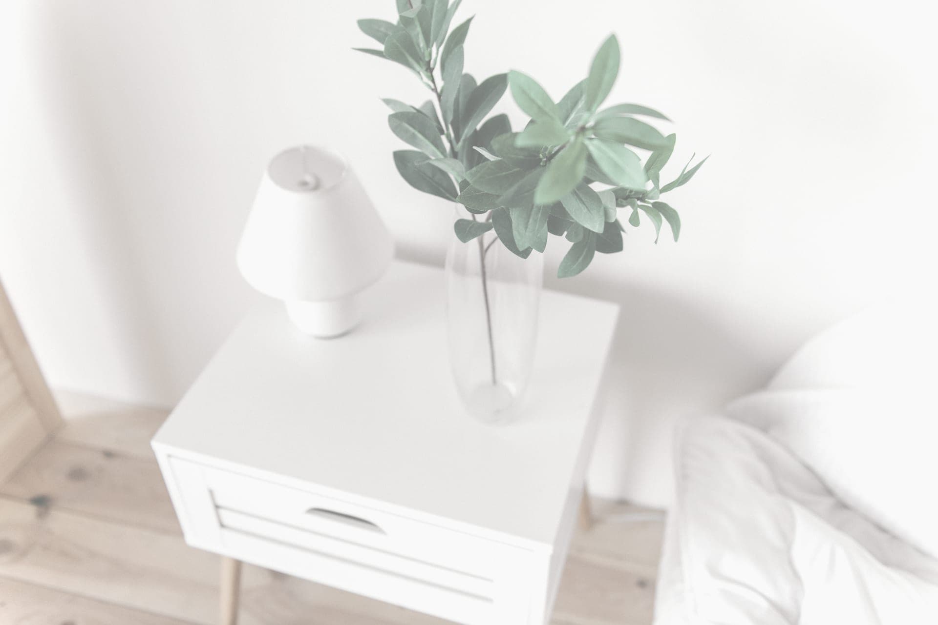 A bright minimal room with pale oak floorboards and abundant natural light