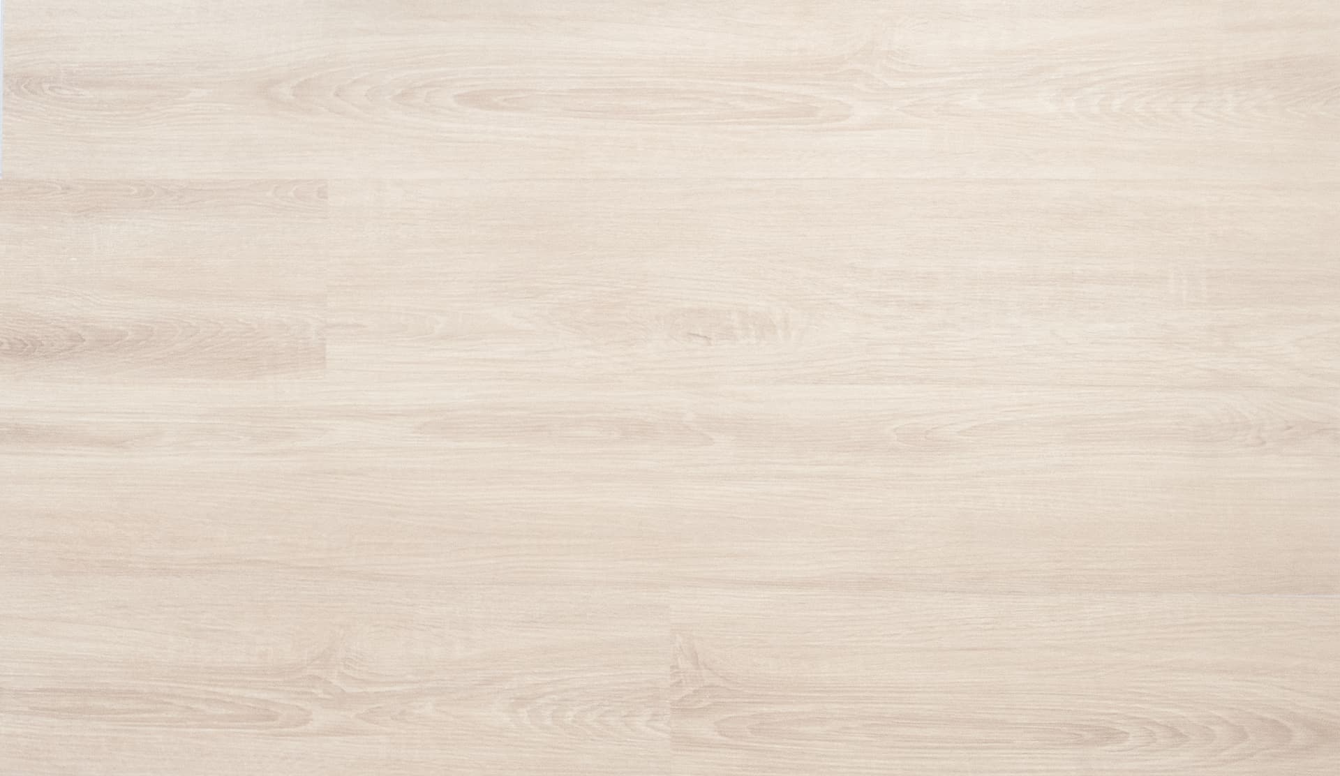 Wide-plank light oak flooring in bright natural light
